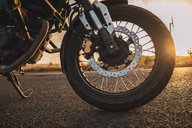 Motorcycle parked on the side of the road, motorcycle travel stock photo