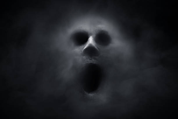 Scary ghost on dark background Scary ghost on dark background fearfull stock pictures, royalty-free photos & images