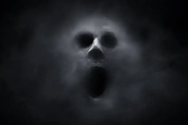 Photo of Scary ghost on dark background