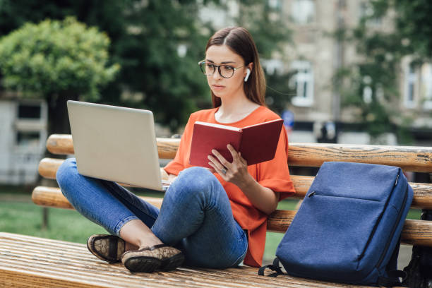 istock Beautiful student learning for her exam outdoors 1334435769
