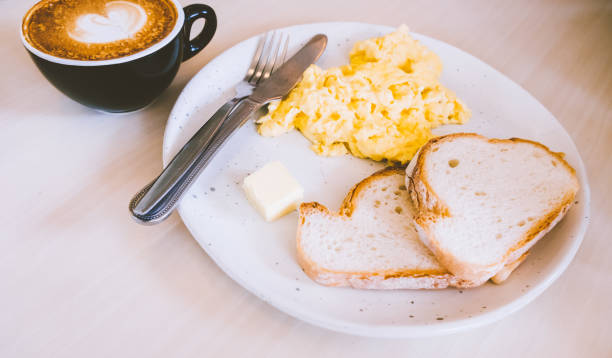 istock Mascarpone Scrambled Eggs with Garlic Toasts with hot coffee latte 1334435892