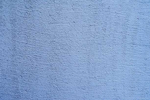 istock Colored plastered wall of blue color. Modern background 1334435958