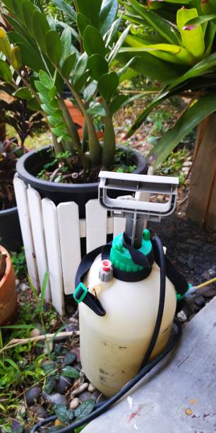istock Garden spray bottle on ground in garden 1334436101