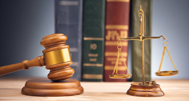 istock scales with judge gavel and law book 1334437289