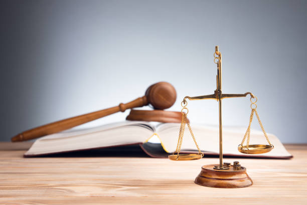 istock scales with judge gavel and law book 1334437290