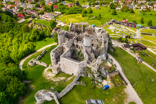 Ogrodzieniec, Poland - June 2, 2021: The beautiful architecture of the ruins of the Ogrodzieniec castle with tourists visiting the historic building, Poland.