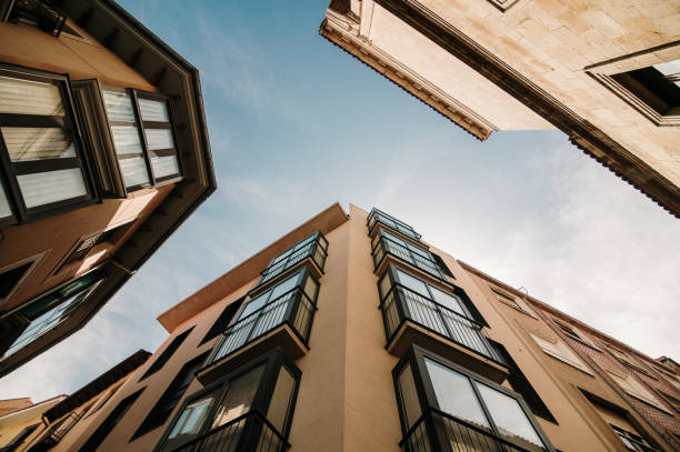 Three residential buildings as seen from below