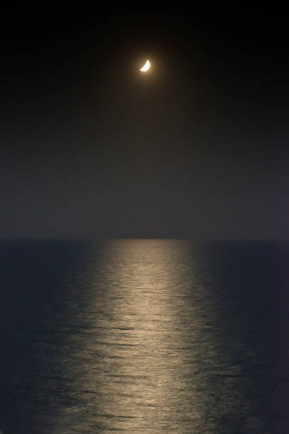 Moonlight reflection on the water stock photo