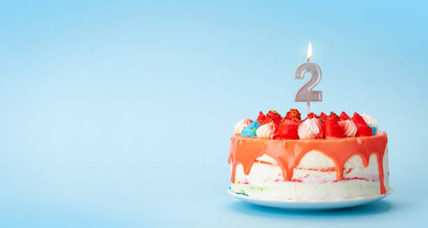 istock Birthday cake with number two candle 1334444871