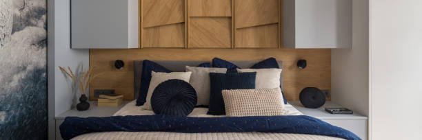 istock Nice and comfortable bedroom with wooden wall, panorama 1334446801
