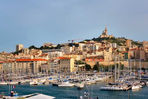 Marseille Old Port (Vieux-Port de Marseille) with yachts and Basilica of Notre-Dame de la Garde. Marseille, France