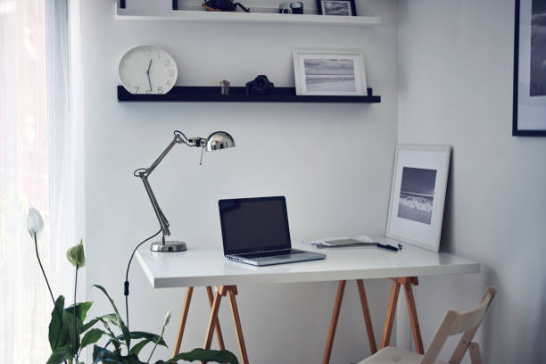 istock Modern home with laptop and table. 1334448723