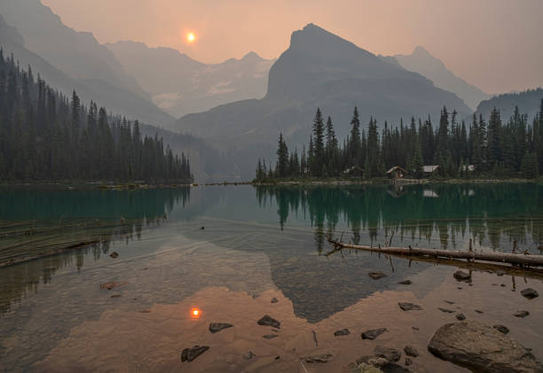Lake O'Hara and Forest Fire Smoke Lake O’Hara shrouded in forest fire smoke in Yoho National Park, British Columbia, Canada yoho national park photos stock pictures, royalty-free photos & images