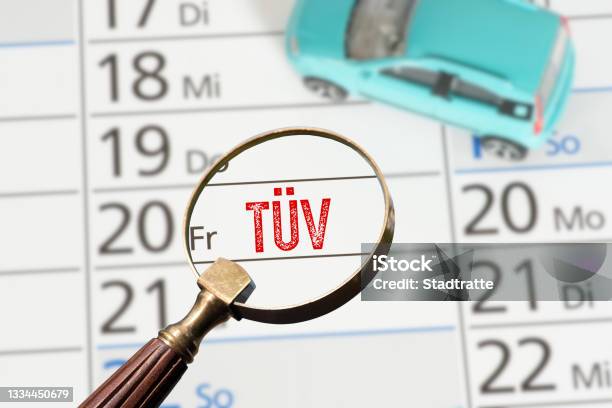 A Car And A Calendar With The Date For A Technical Inspection Tüv Stock Photo - Download Image Now