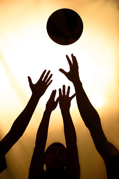 istock Silhouette of people playing basketball 133445100