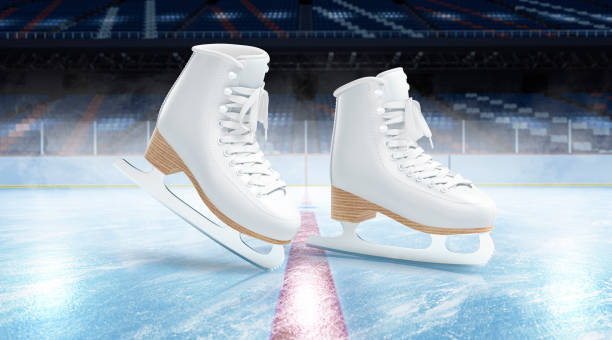 Young loving couple skating at ice rink outdoors, close-up view of the skates