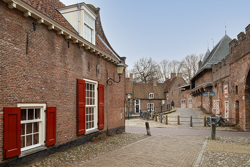 View of the medieval city of Amersfoort with the old city gate the Koppelpoort. in the background. This city gate is a combination of a land and water gate which is very special.