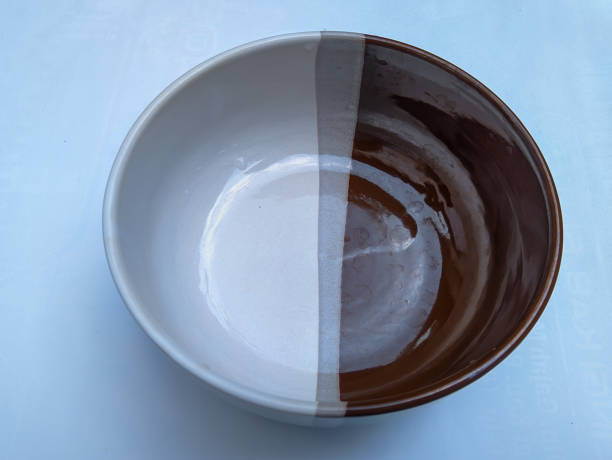 istock classic bowl with 2 colors (brown and cream) isolated on white background 1334454500