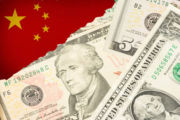 istock Dollar banknotes and flag of China 1334455831