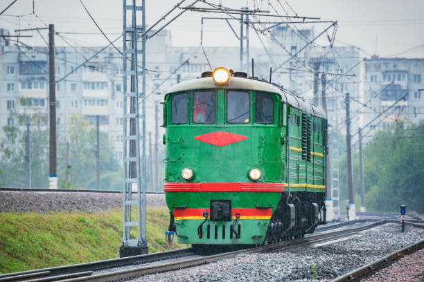 istock Freight retro diesel locomotive under the rain. 1334456066