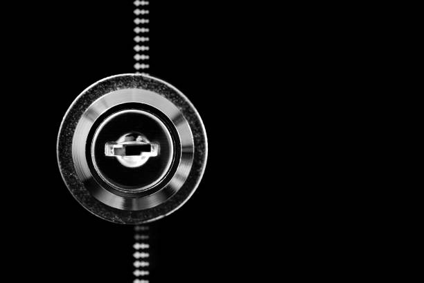 Closeup of keyhole on dark background