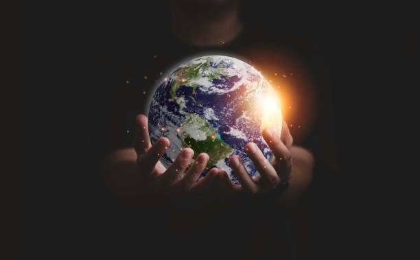 istock Earth inside of two hands for earth day and saving energy environment concept ,Element of this image from NASA and 3d render. 1334464247