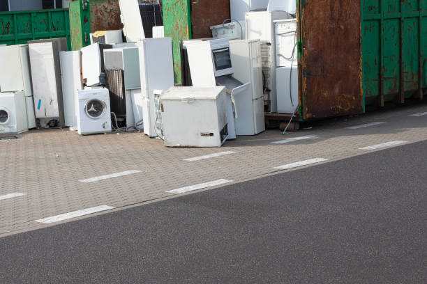 istock Old electrical appliances, washing machines in container. Recycling center. 1334464440