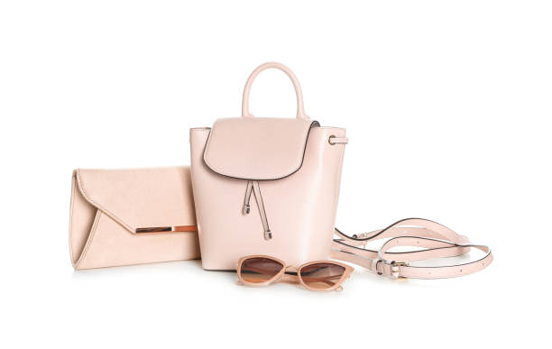 istock Different stylish woman's bags and sunglasses isolated on white 1334464965