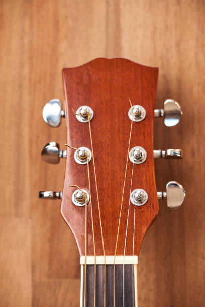 istock Front view of a guitar headstock. Close-up vertical image. 1334466791