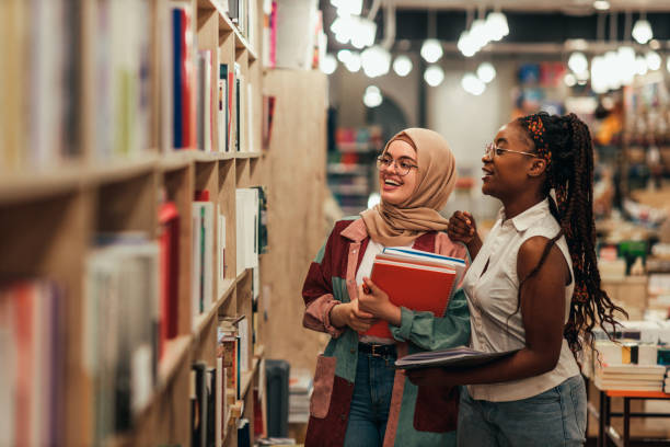 istock Diverse classmates searching for relevant literature at library 1334469539