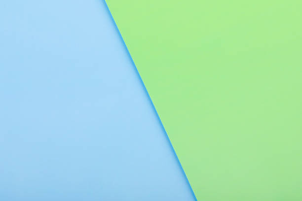istock background of blue and green paper sheets 1334469744