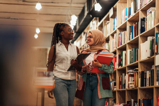 istock Female students studying in college library 1334469800