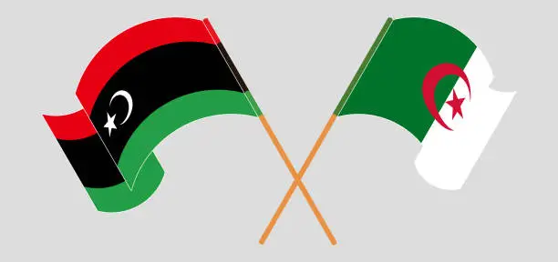 Vector illustration of Crossed and waving flags of Libya and Algeria