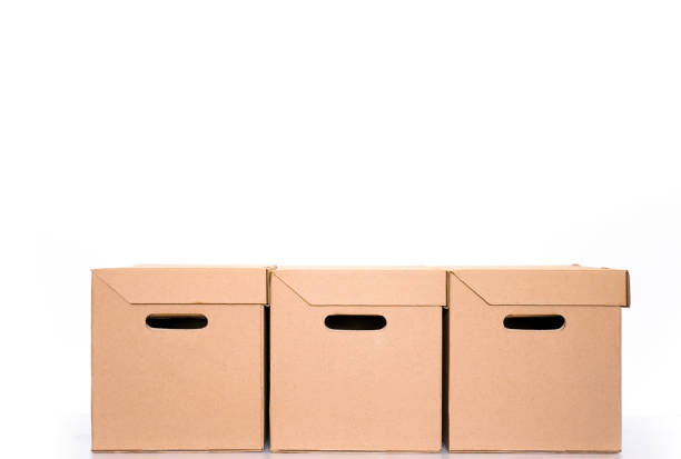 stack of delivery or parcels cardboard boxes on a white background with copy space. shipping and logistics. Online shopping and delivery concept