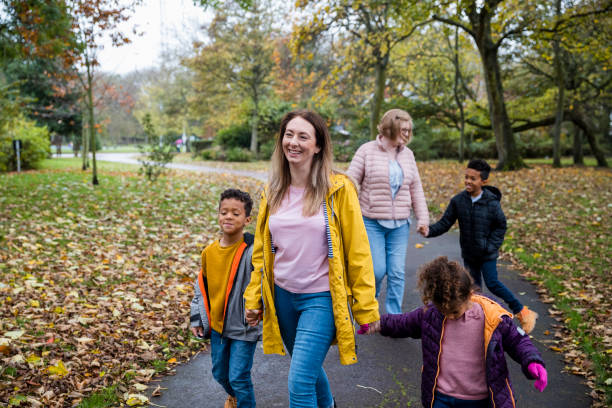 Family Walking Through Public Park