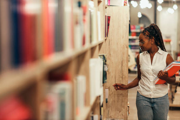 istock Woman searching for relevant literature at library 1334470922