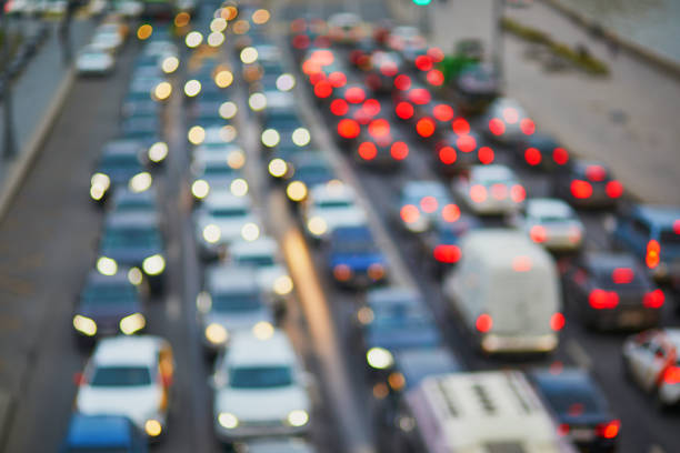 Huge traffic jam in large megapolis Huge traffic jam in large megapolis, blurred picture traffic jam stock pictures, royalty-free photos & images