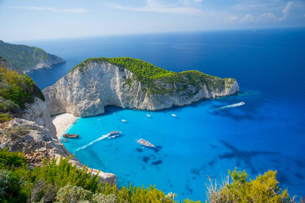 Aerial view on Navagio sandy beach with famous shipwreck on north west coast of Zakynthos island, Greece Aerial view on Navagio sandy beach with famous shipwreck on north west coast of Zakynthos island, Greece zakynthos stock pictures, royalty-free photos & images
