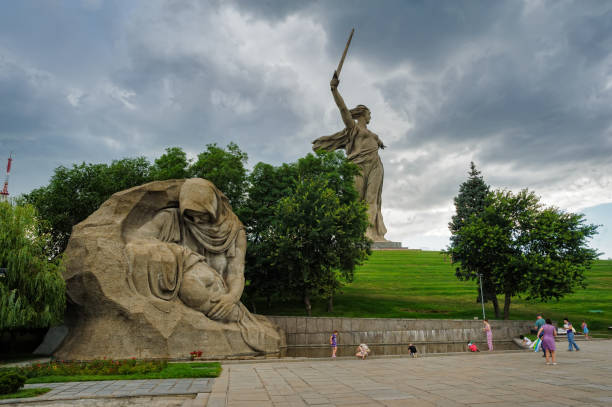The grieving mother monument. Volgograd, Russia Volgograd, Russia - July 10, 2017: The grieving mother and Motherland Calls monuments. Memorial complex Mamayev Kurgan super film title stock pictures, royalty-free photos & images