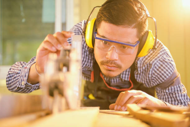 istock Portrait carpenter man  happy attractive hardworking 1334476118