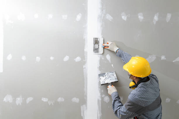 interior decoration construction furniture builtin interior decoration construction furniture builtin.Plasterer in working uniform plastering the wall indoors. drywall stock pictures, royalty-free photos & images