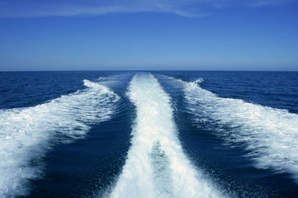 istock Boat white wake on the blue ocean sea 1334478677