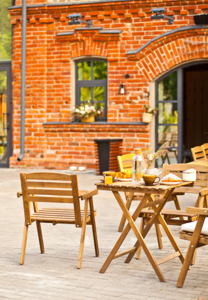 istock Outdoor street cafe with empty tables and chairs 1334483826