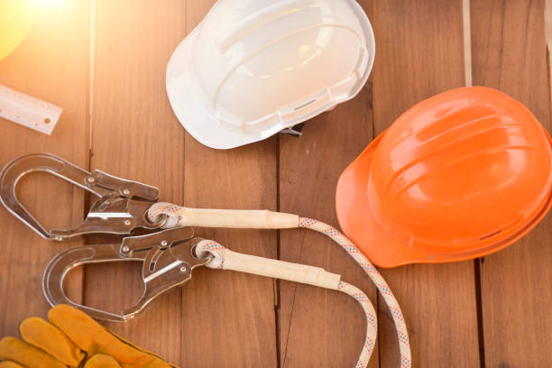 helmet hardhat with instruments gear tools on table wood. stock photo