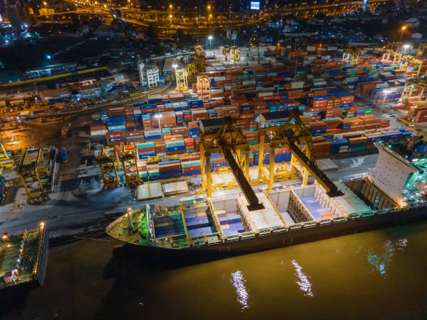 istock Technology business working all time in growth in e-commerce businesss during covid-19  import/export and transportation of Container Cargo ship 1334484225