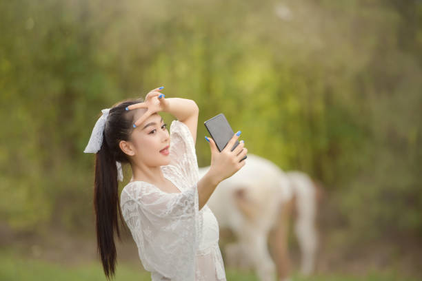 city lifestyle woman with phone outdoor stock photo