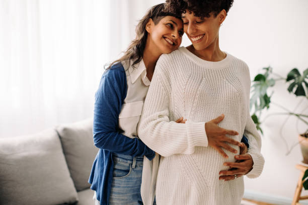 istock Happy lesbian couple expecting a baby 1334486670