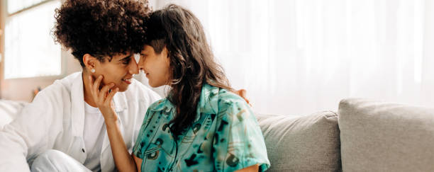 istock Young female couple sharing an intimate moment at home 1334486830
