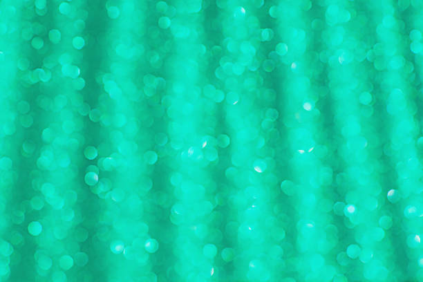 istock Blurred holiday bokeh.Defocused abstract green background. 1334486861