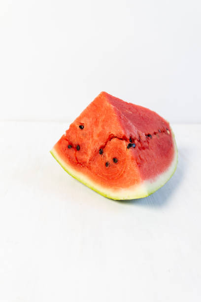 istock slice of watermelon on white wooden table 1334488057